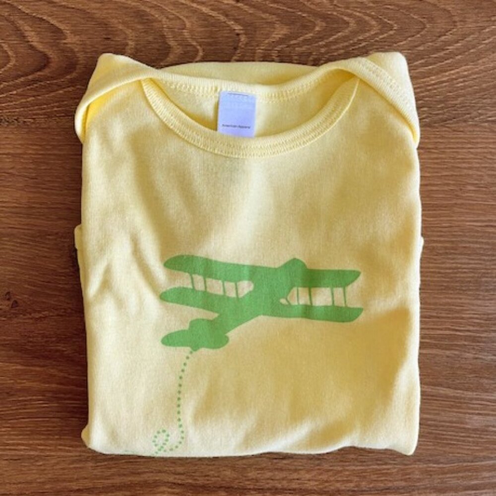 Swooping airplane screen-printed onesie NWOT